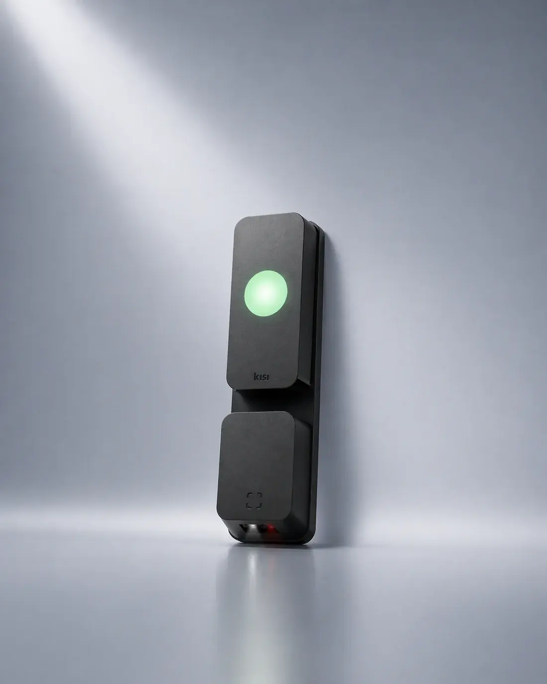 A Kisi access reader showing a green unlock light